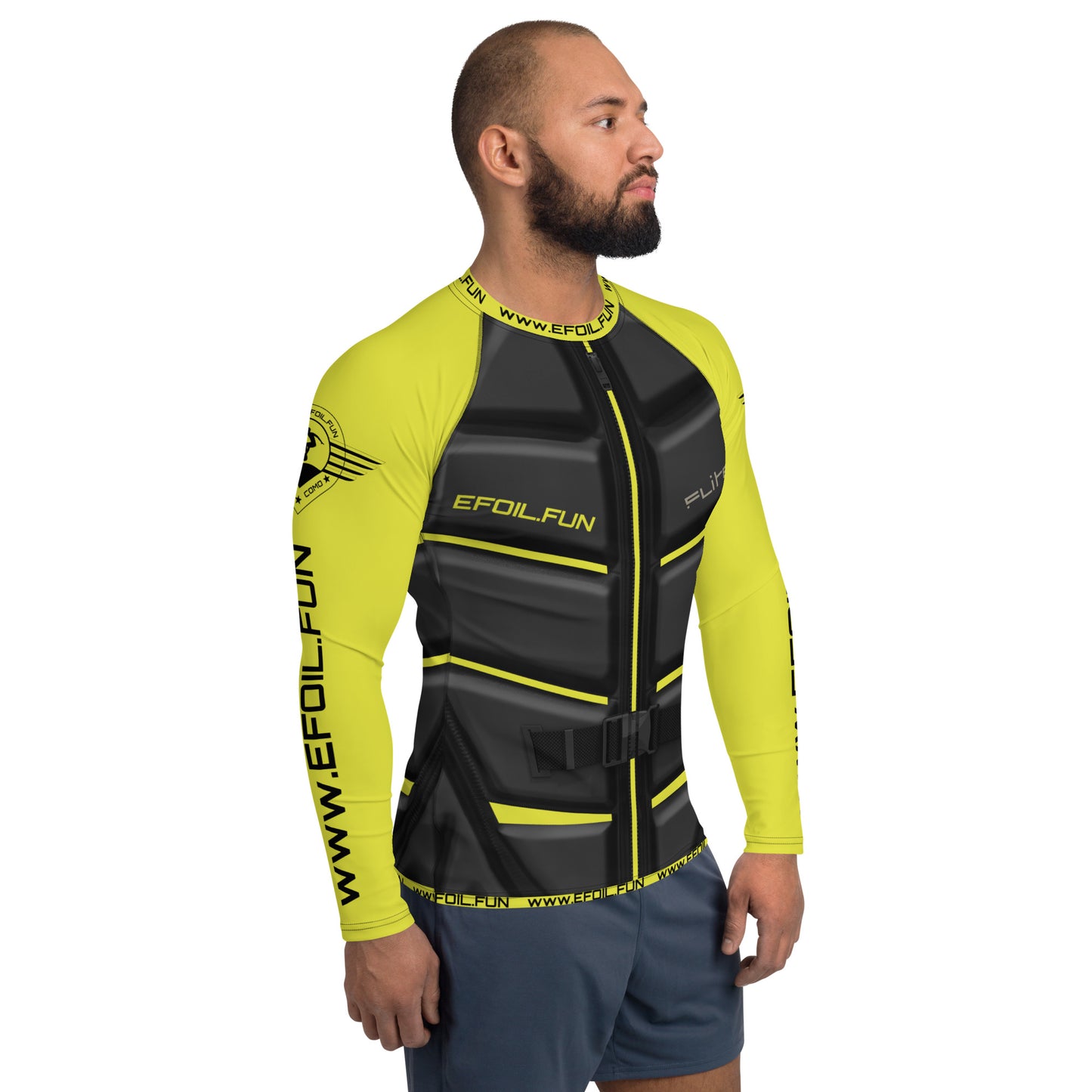 Man wearing a yellow and black long-sleeve rash guard for men's sports with ergonomic seams and sun protection features.